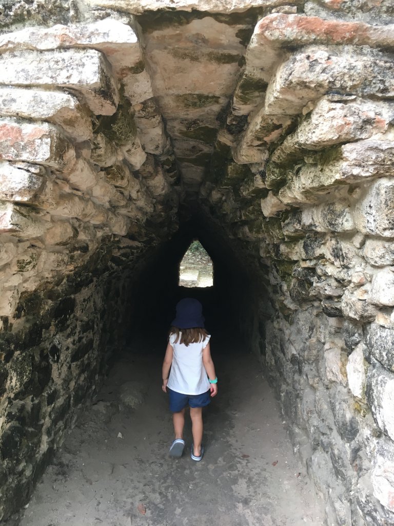 O exploring the many tunnels in Coba
